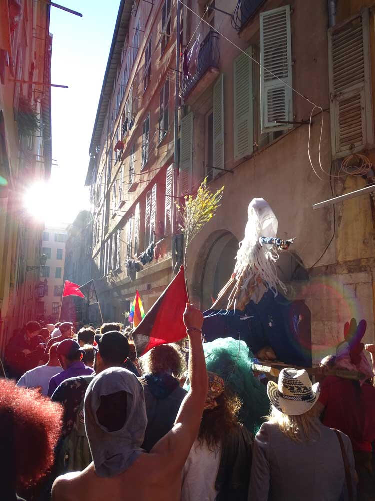 Public celebration, Nice - May Day festivities bring shared rituals into the streets, reinforcing collective cultural traditions.